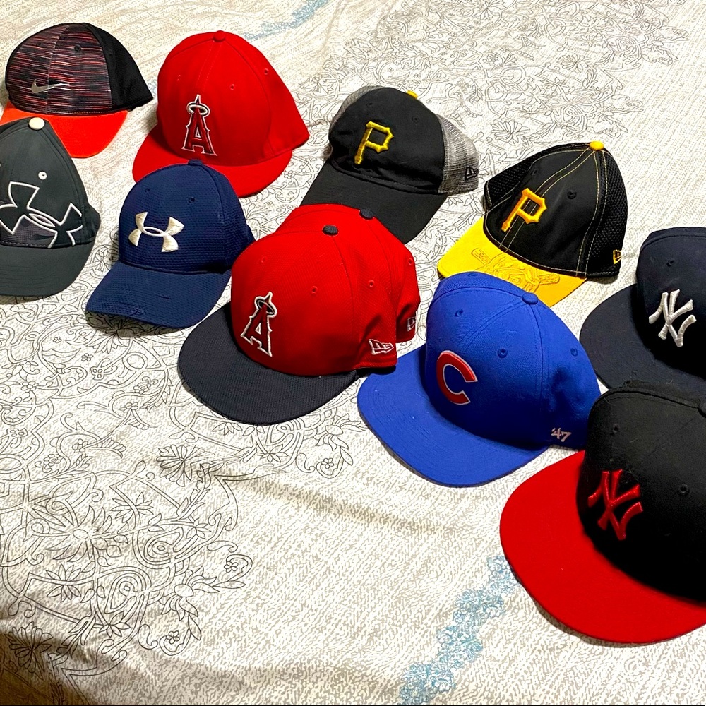Assorted baseball hats Cubs Yankees Pirates Angels Under Armour Nike